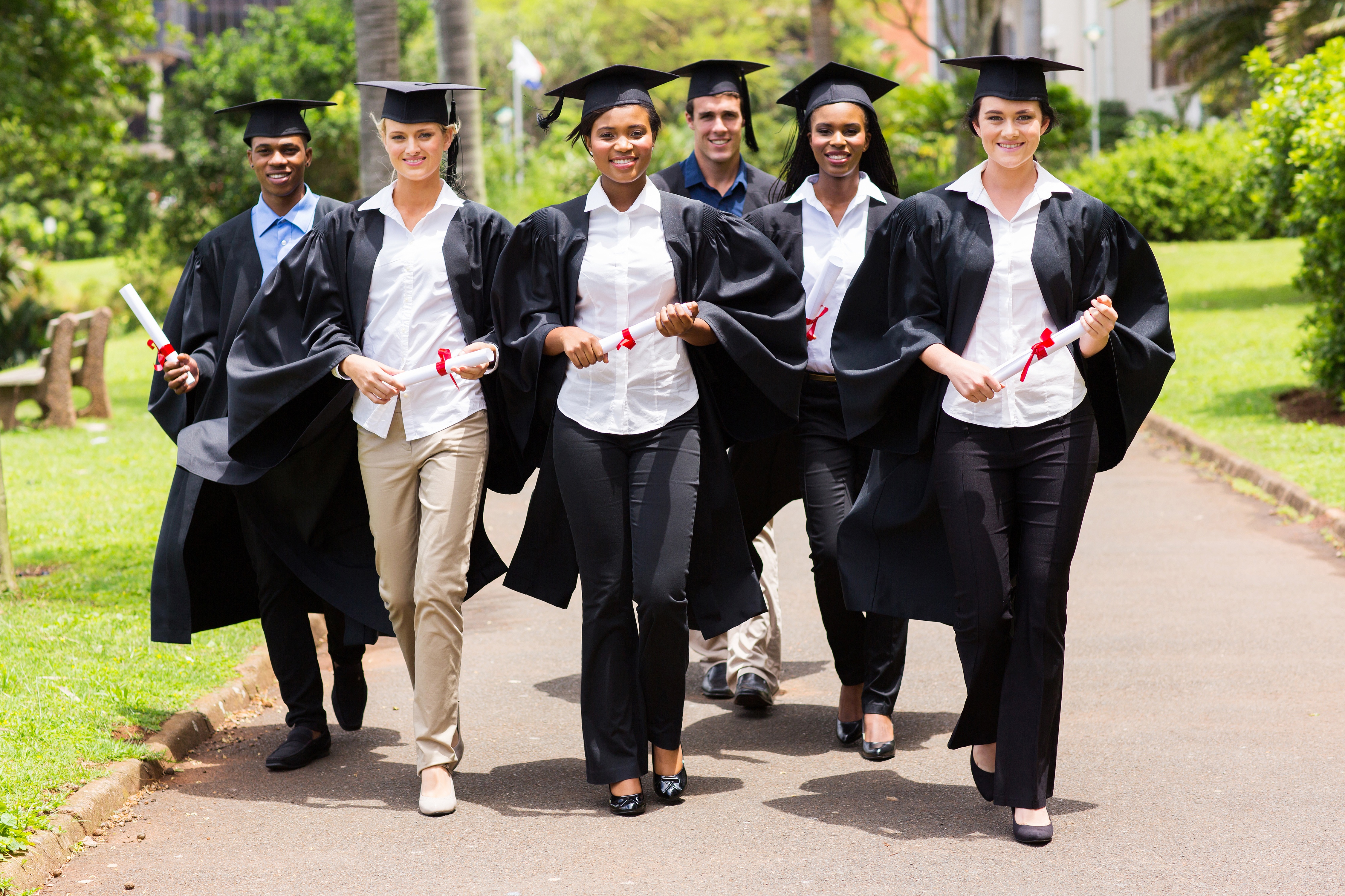 A diverse group of students graduating from a traditional higher education institution